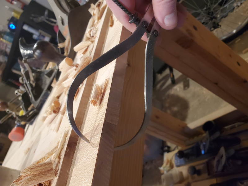 Checking the thickness of the breadboard tenon with calipers